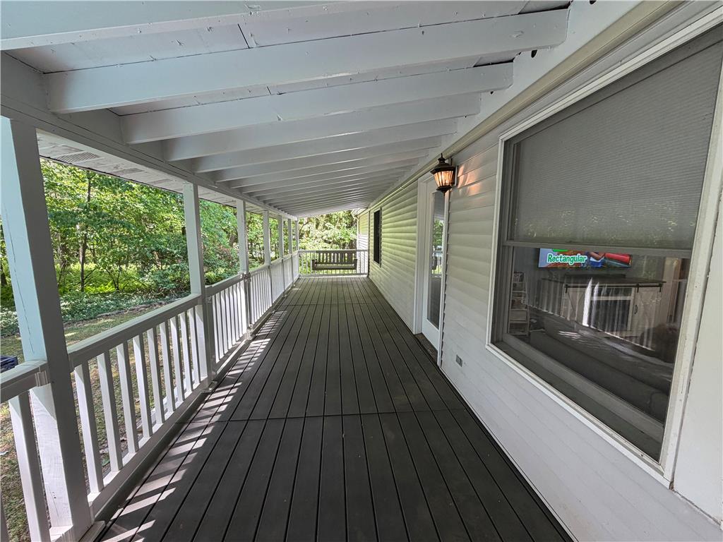 60 Sassafras Road Lehighton, PA 18235 - Photo 4 of 36 A deep covered porch provides a tranquil outdoor retreat with wooded views.