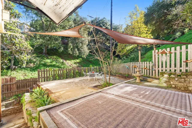 a view of a backyard with a small deck