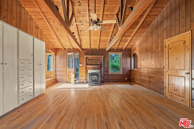 a bathroom with a granite countertop sink a mirror and a bathtub