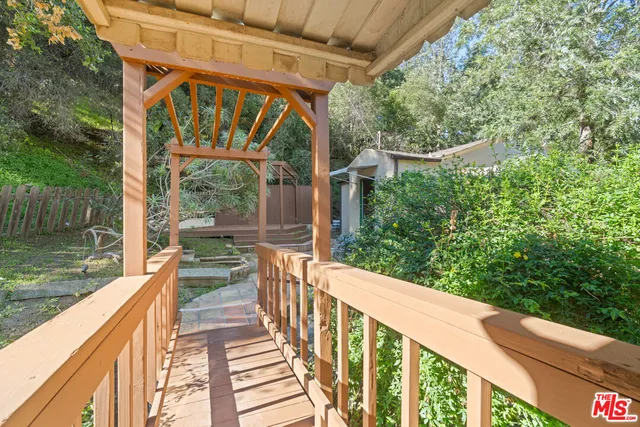 a backyard of a house with wooden floor