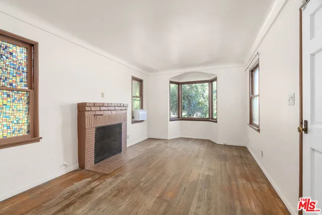 a view of a livingroom with furniture and wooden floor