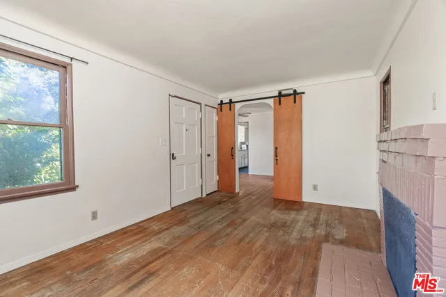 a kitchen with a sink and a refrigerator