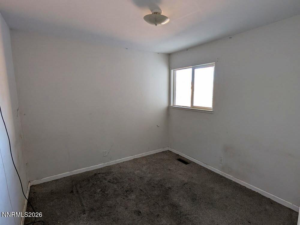 848 C Street Fernley, NV 89408 - Photo 11 of 15 an empty room with a window