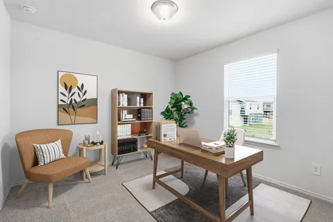 a workspace with furniture and window