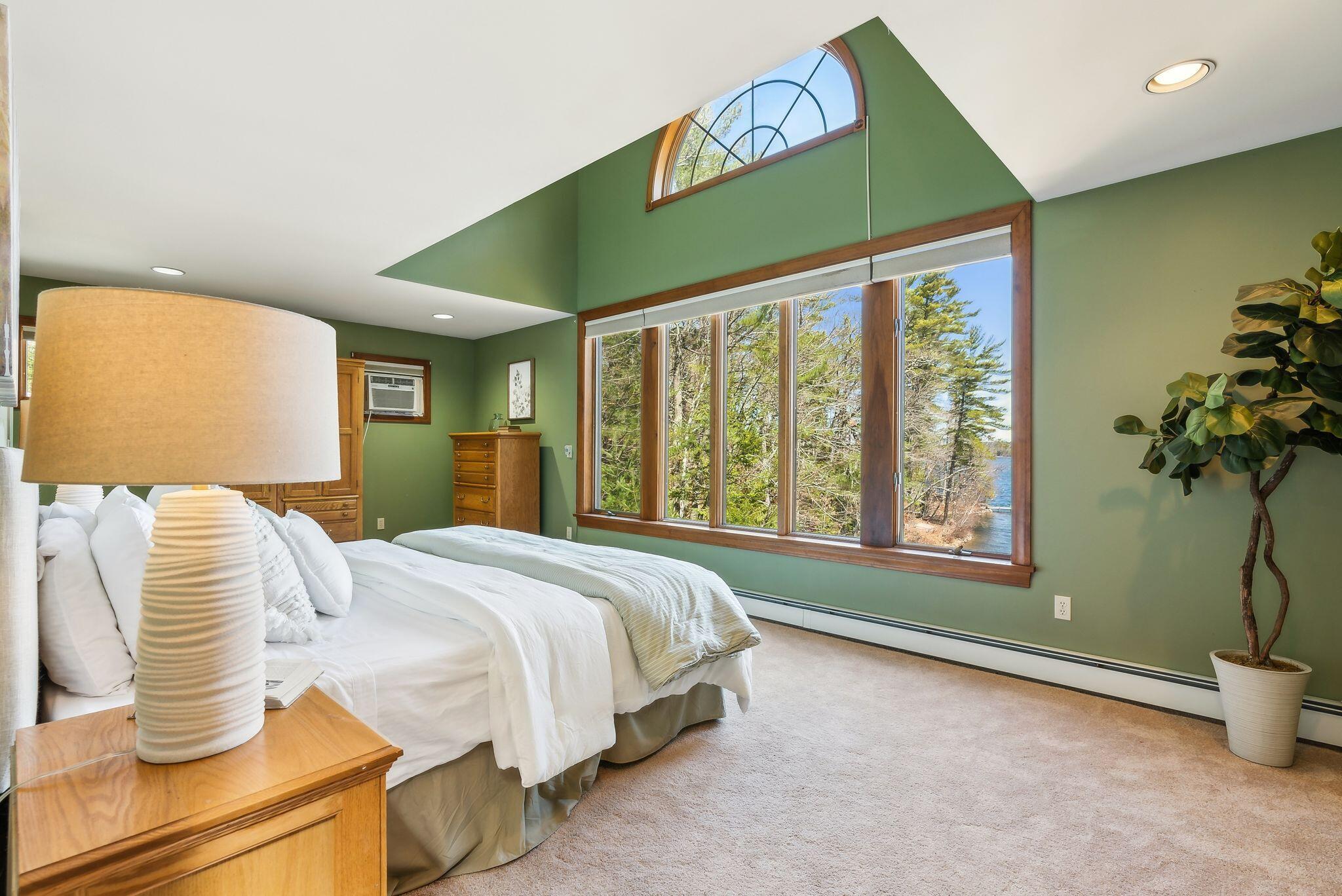 160 Lyons Point Road Raymond, ME 04071 - Photo 24 of 65 Primary bedroom with views of the lake!