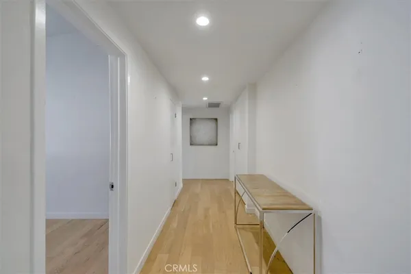 a view of an empty room with empty shelves