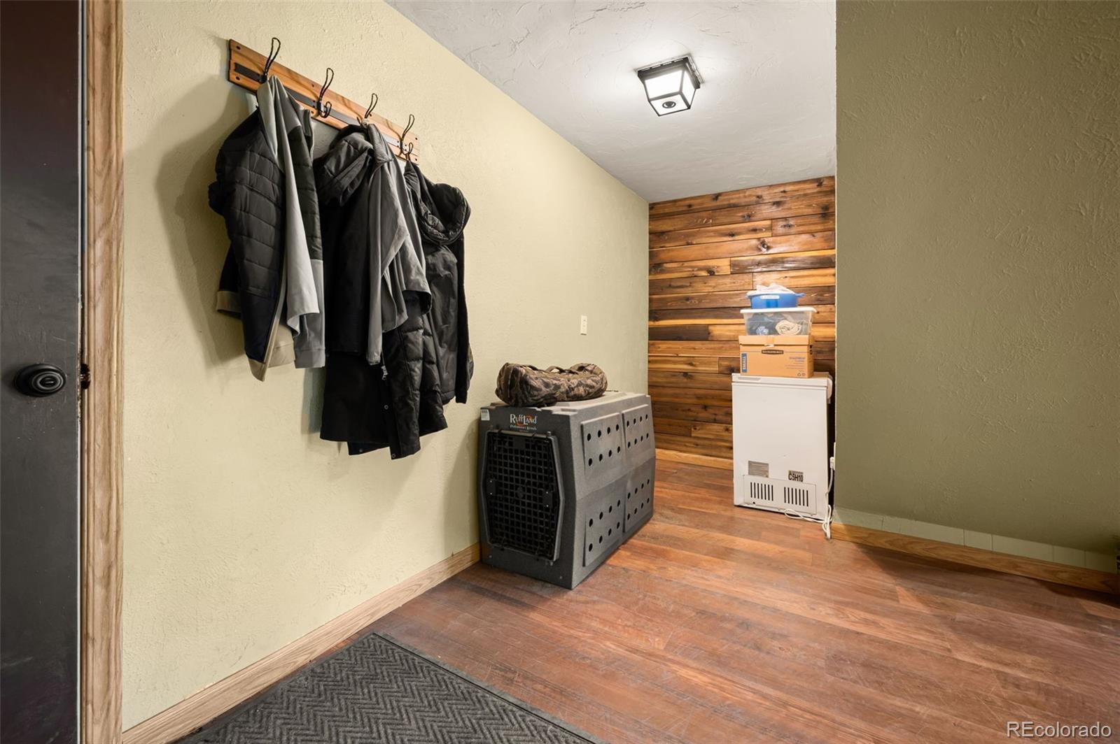 30315 Lone Spruce Road Evergreen, CO 80439 - Photo 25 of 48 a view of walk in closet with clothes and shoes