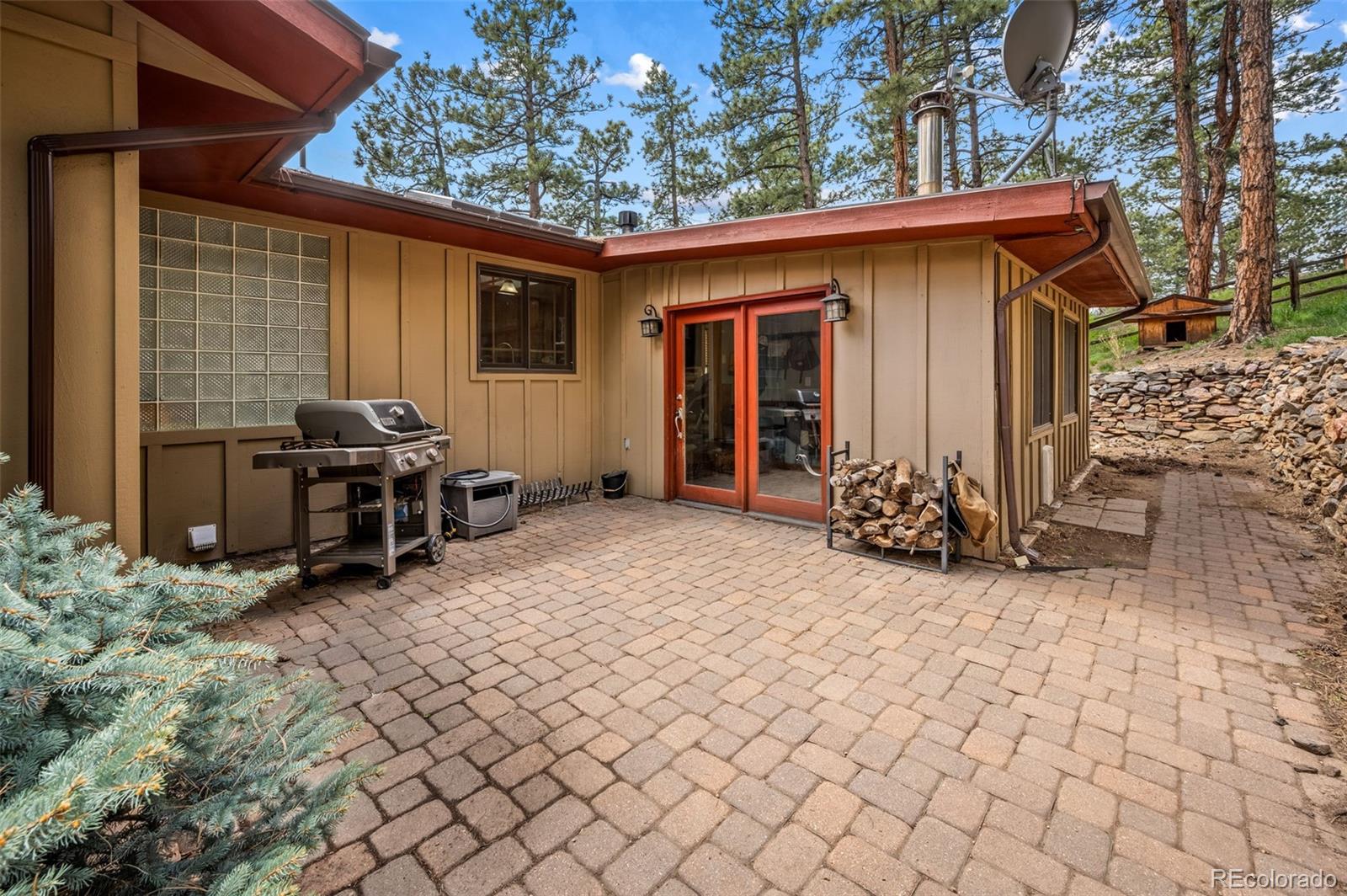 30315 Lone Spruce Road Evergreen, CO 80439 - Photo 33 of 48 a view of a house with backyard
