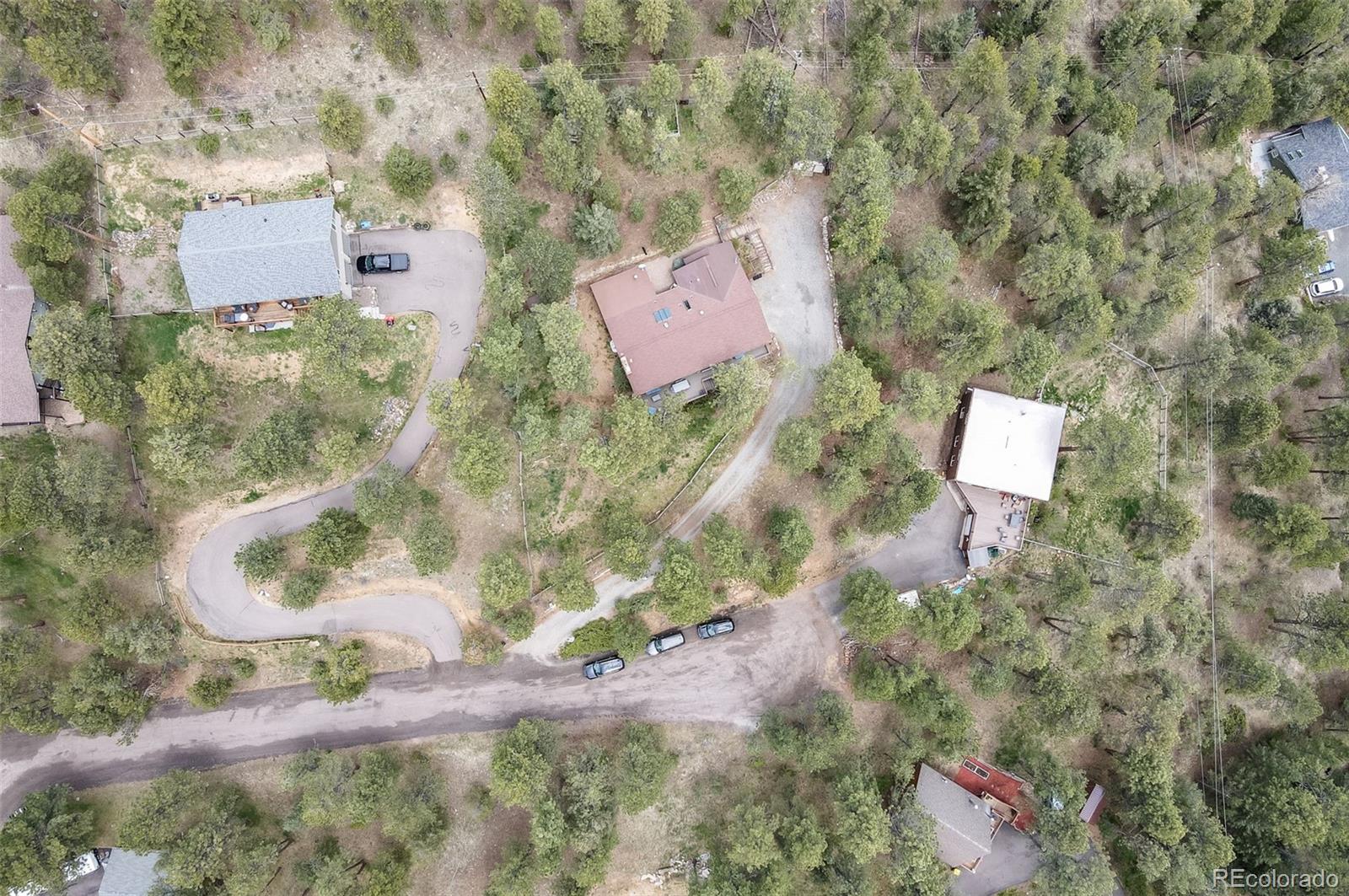 30315 Lone Spruce Road Evergreen, CO 80439 - Photo 41 of 48 an aerial view of residential house with outdoor space