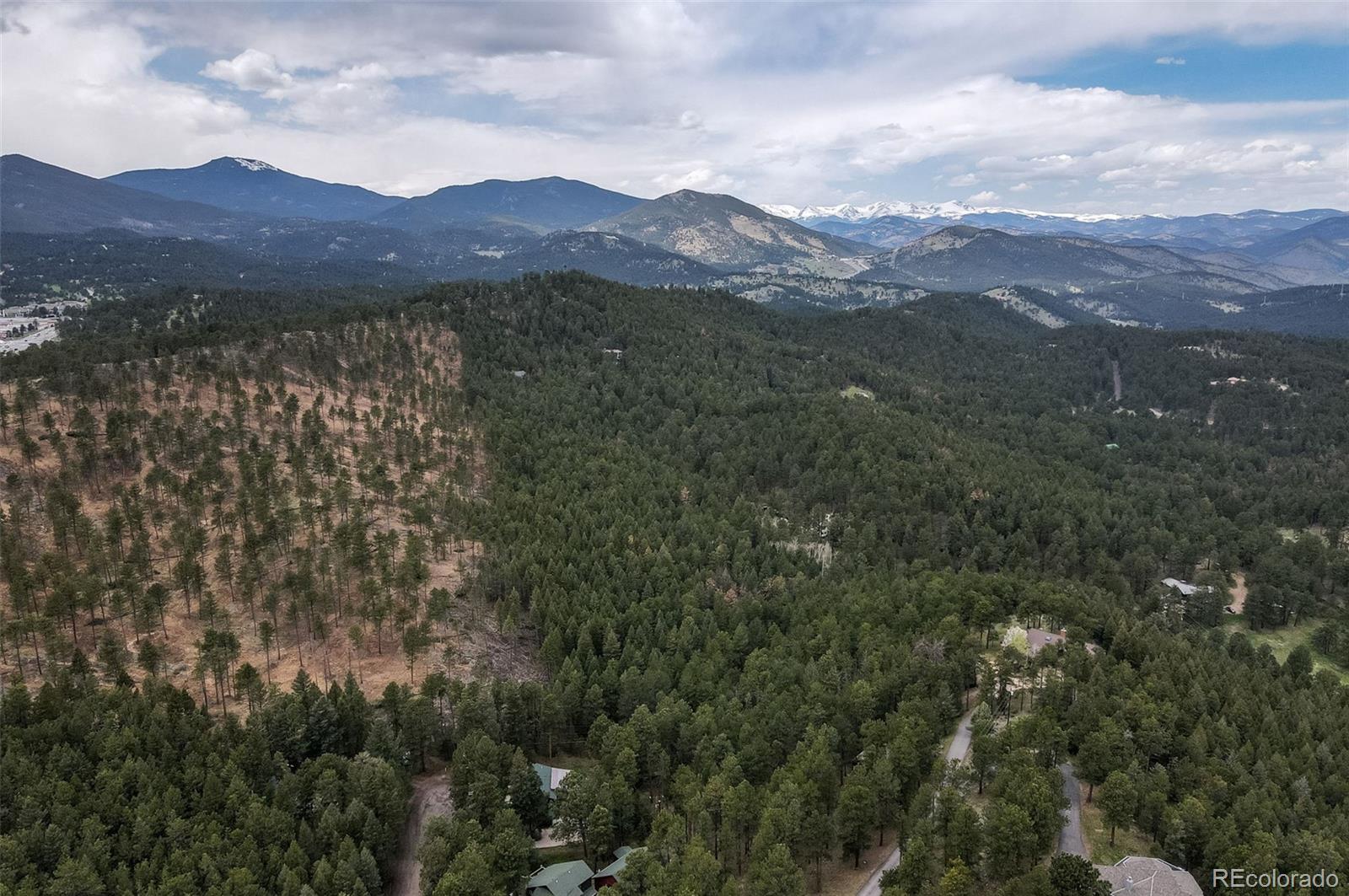 30315 Lone Spruce Road Evergreen, CO 80439 - Photo 43 of 48 a view of mountain and a lake view