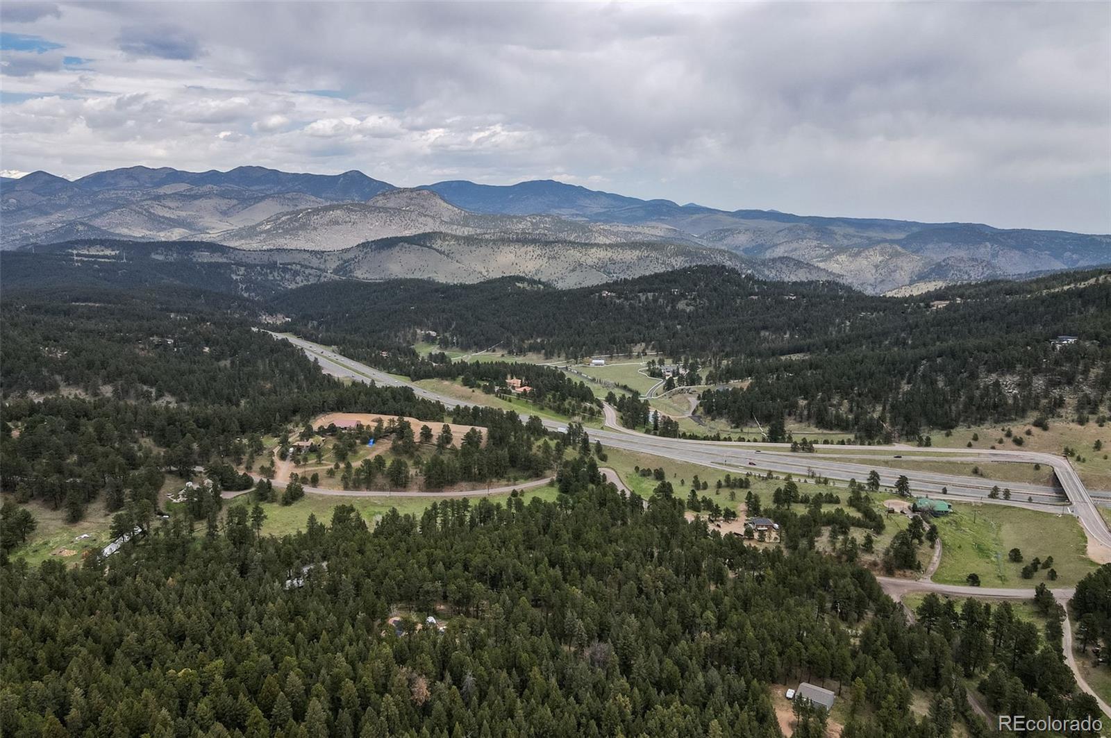 30315 Lone Spruce Road Evergreen, CO 80439 - Photo 44 of 48 a view of a city with mountain