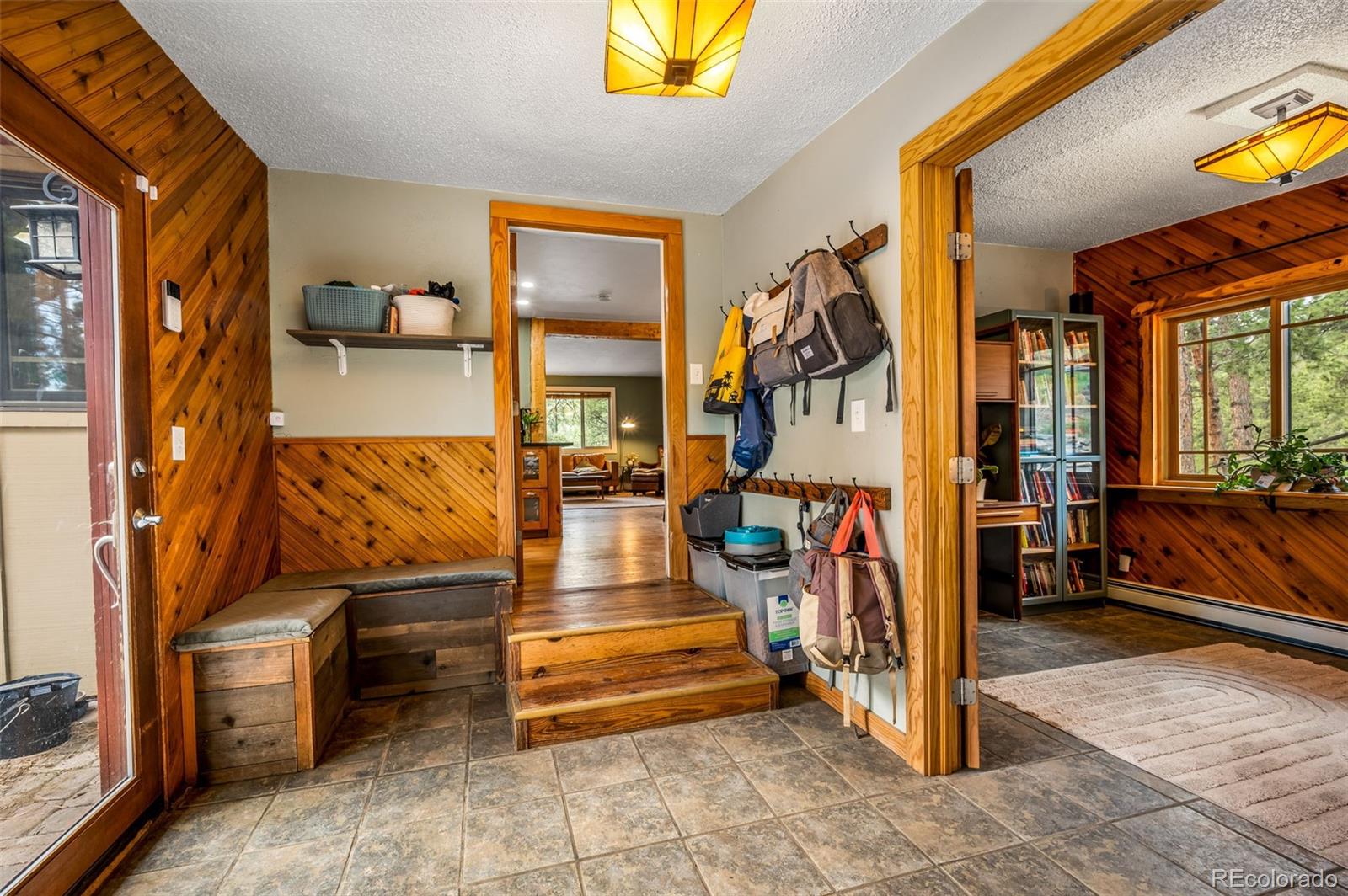 30315 Lone Spruce Road Evergreen, CO 80439 - Photo 9 of 48 a view of living room kitchen and dining room