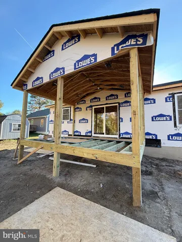 a view of a house with a flat bed and wooden roof