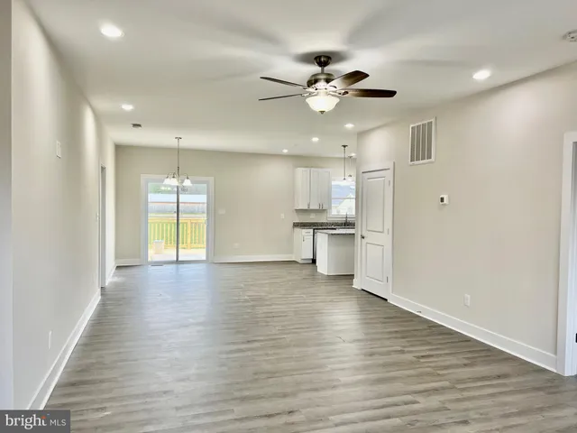 a view of a kitchen with a sink and a window