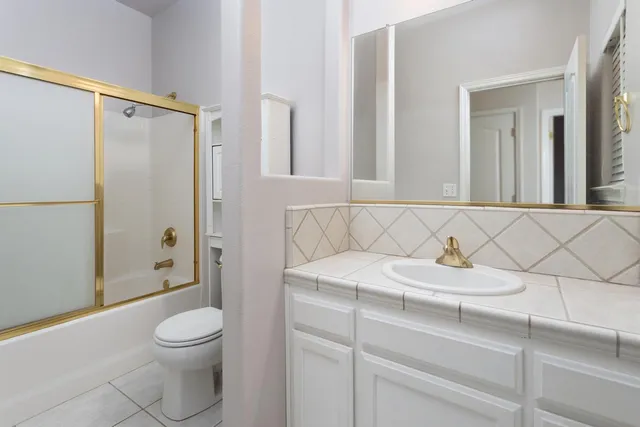 an empty room with a ceiling fan