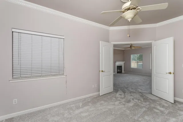 a view of a backyard with wooden fence