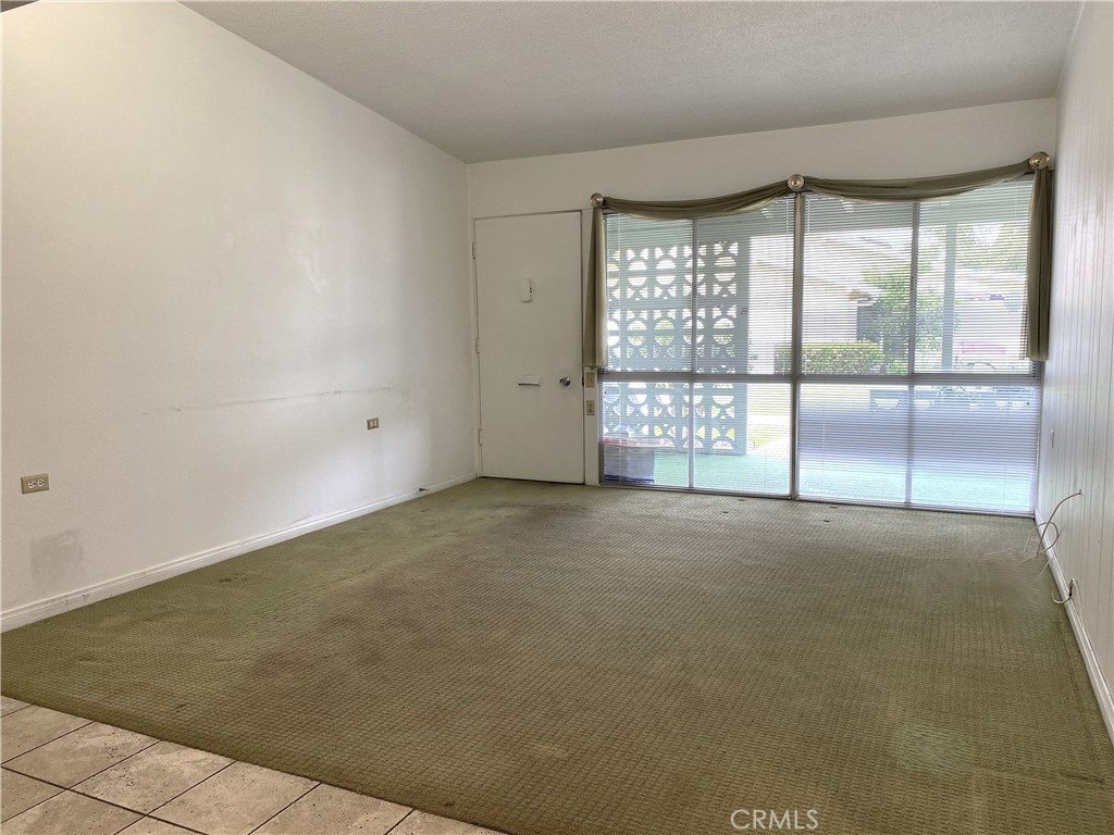 1361 Wee Burn Road Seal Beach, CA 90740 - Photo 11 of 13 a view of an empty room with a window