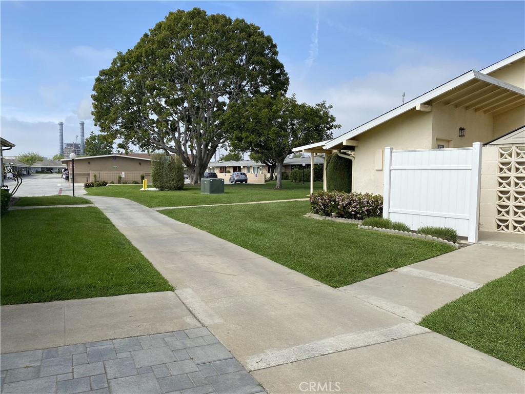 1361 Wee Burn Road Seal Beach, CA 90740 - Photo 5 of 13 a front view of a house with a yard