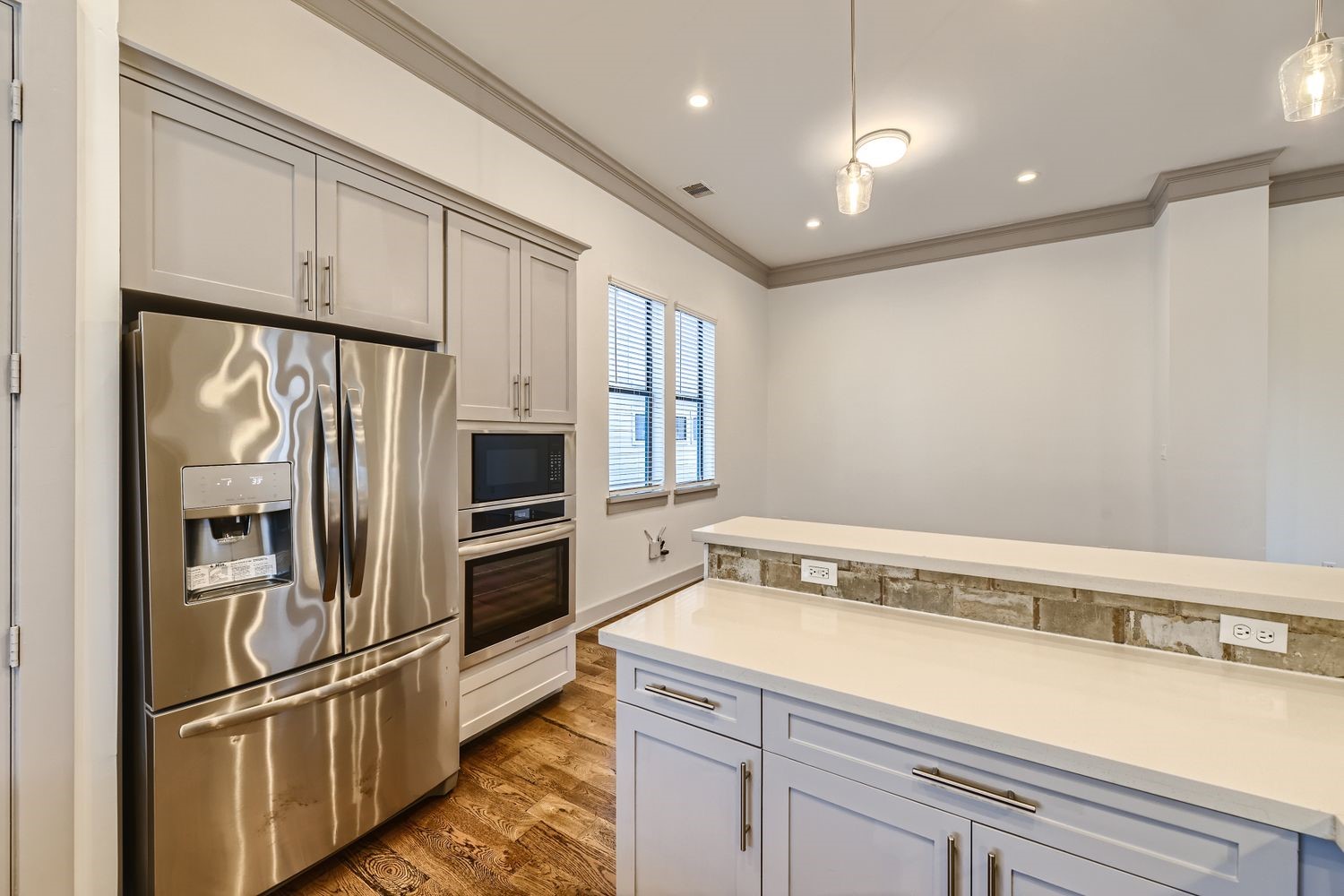 2208 Arabelle Street Houston, TX 77007 - Photo 5 of 26 a kitchen with granite countertop a refrigerator and a sink