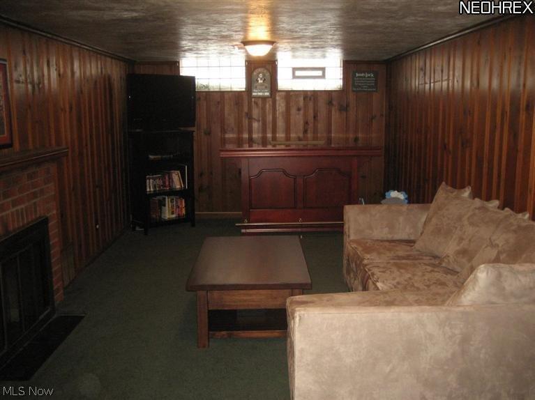 3877 Bushnell Road Cleveland, OH 44118 - Photo 17 of 19 Fabulous Lower Level Family Room with Glass Block Windows, Gas Fireplace and Carpeting.