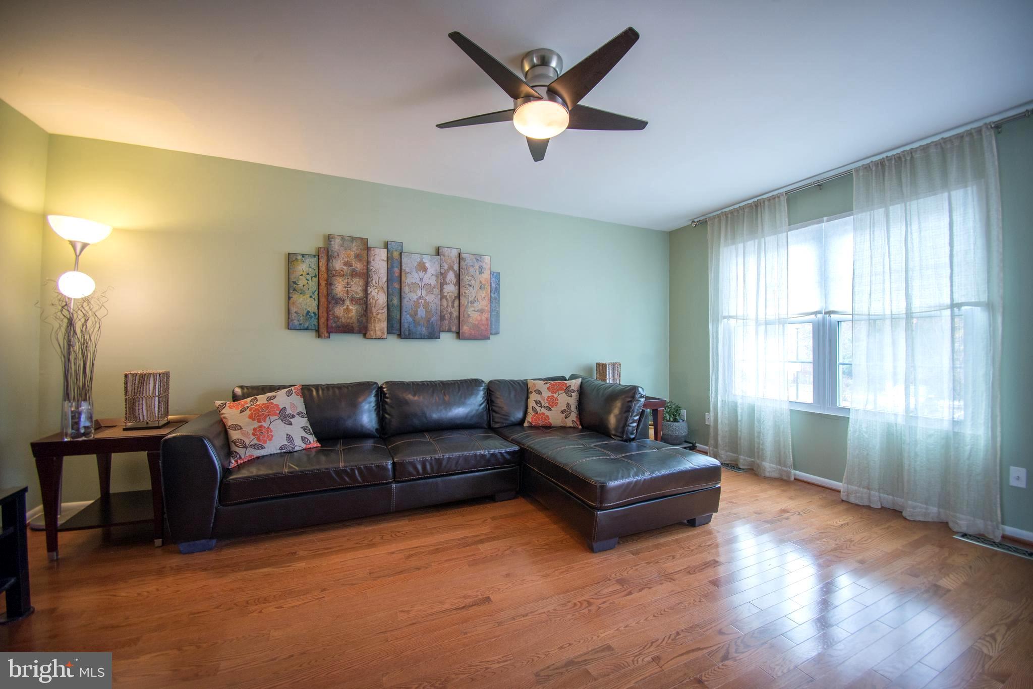 523 Brighton Place Baltimore, MD 21221 - Photo 3 of 30 Living room w/ real hardwood floors