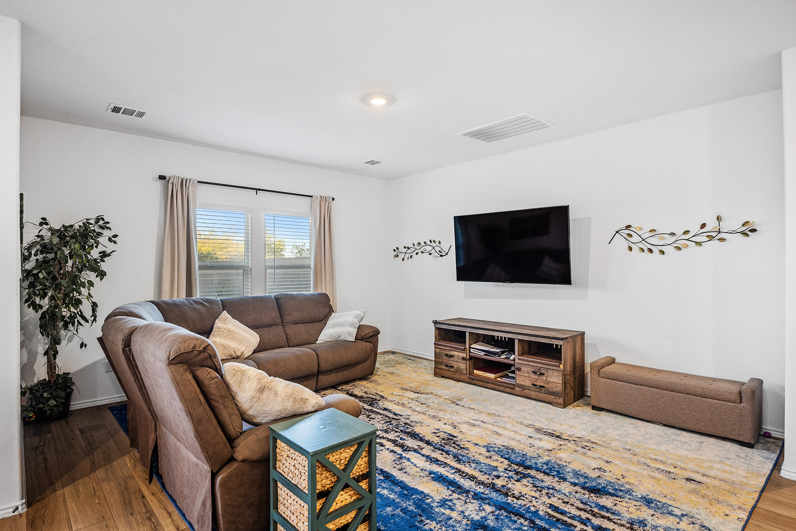 1909 Four Waters Loop Georgetown, TX 78628 - Photo 12 of 35 a living room with furniture and a flat screen tv