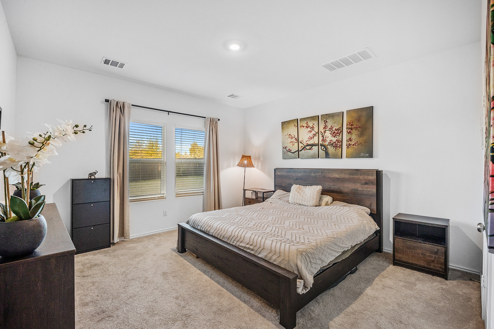 1909 Four Waters Loop Georgetown, TX 78628 - Photo 15 of 35 a bedroom with a bed and a couch