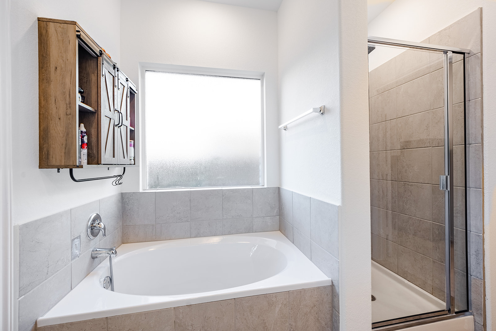 1909 Four Waters Loop Georgetown, TX 78628 - Photo 17 of 35 a bathroom with a bathtub and a shower