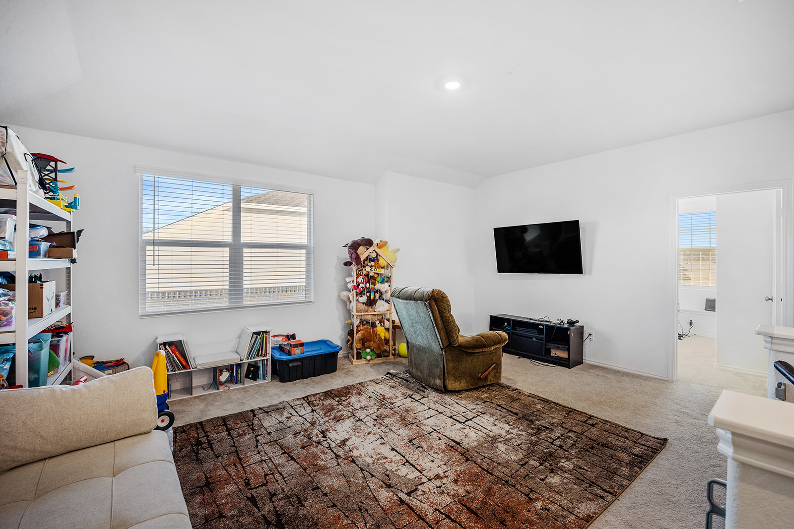 1909 Four Waters Loop Georgetown, TX 78628 - Photo 19 of 35 a living room with furniture and a flat screen tv