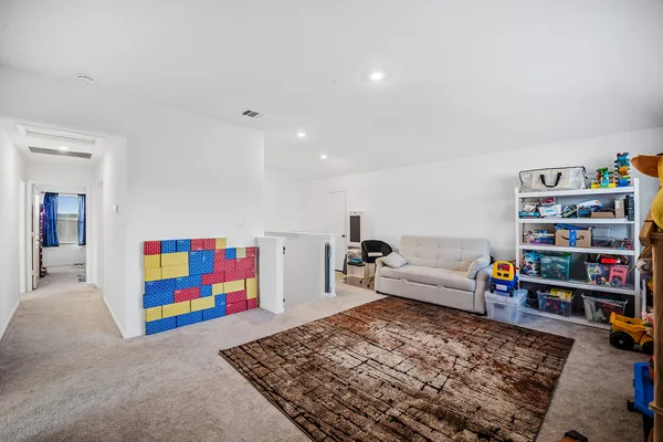 a bathroom with a granite countertop sink toilet a mirror and shower