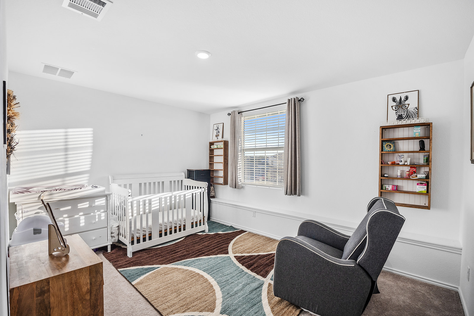 1909 Four Waters Loop Georgetown, TX 78628 - Photo 21 of 35 a bedroom with furniture and a window