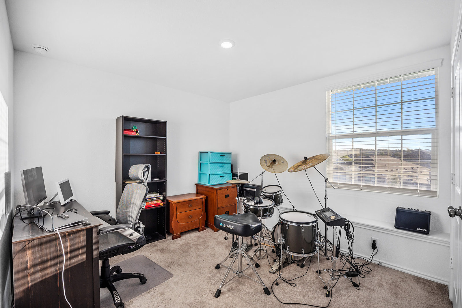 1909 Four Waters Loop Georgetown, TX 78628 - Photo 23 of 35 a view of a workspace with furniture and a window