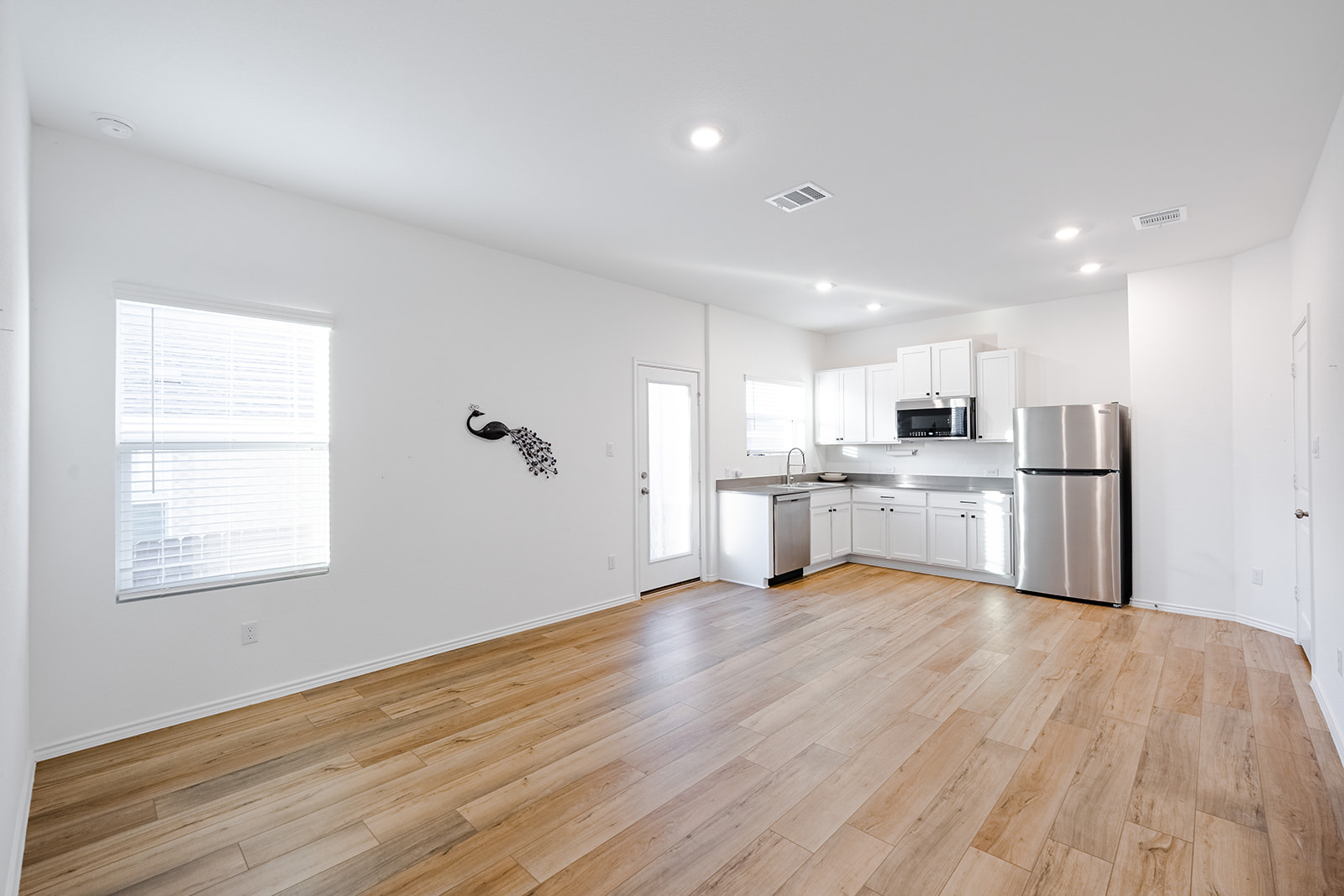 1909 Four Waters Loop Georgetown, TX 78628 - Photo 26 of 35 a view of kitchen with wooden floor