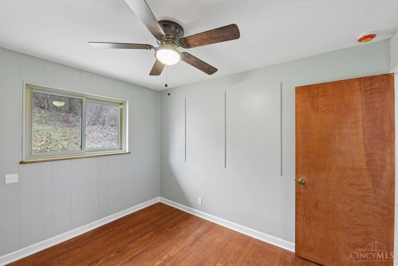 5258 Shepherd Road Cincinnati, OH 45223 - Photo 24 of 43 Here is Bedroom 2! Features include a Lighted Ceiling Fan, Vinyl Windows, Wood Flooring, and a closet.