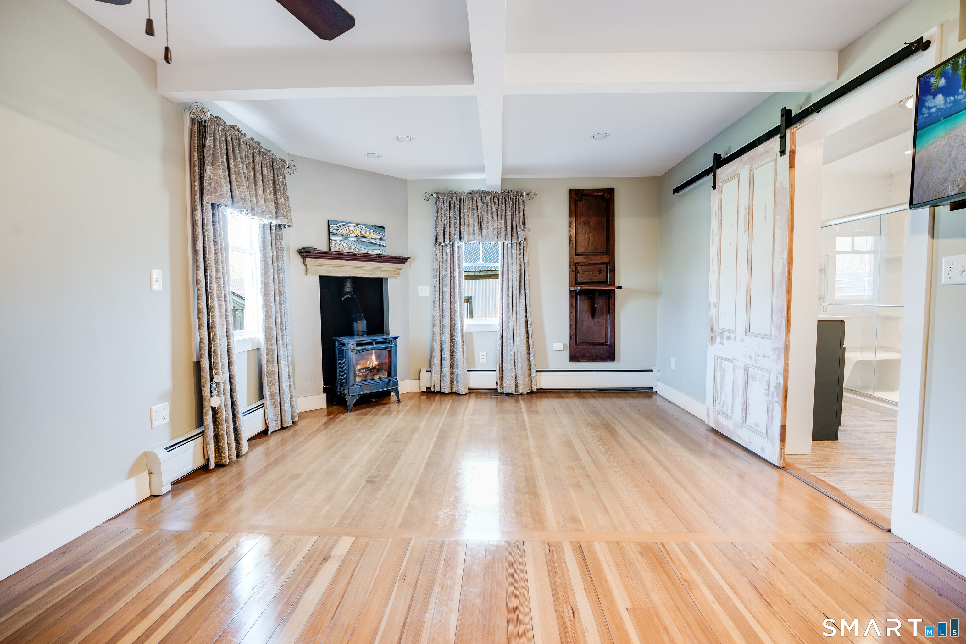 112 Schulman Veslak Road East Haddam, CT 06423 - Photo 12 of 26 a view of a livingroom with wooden floor and staircase
