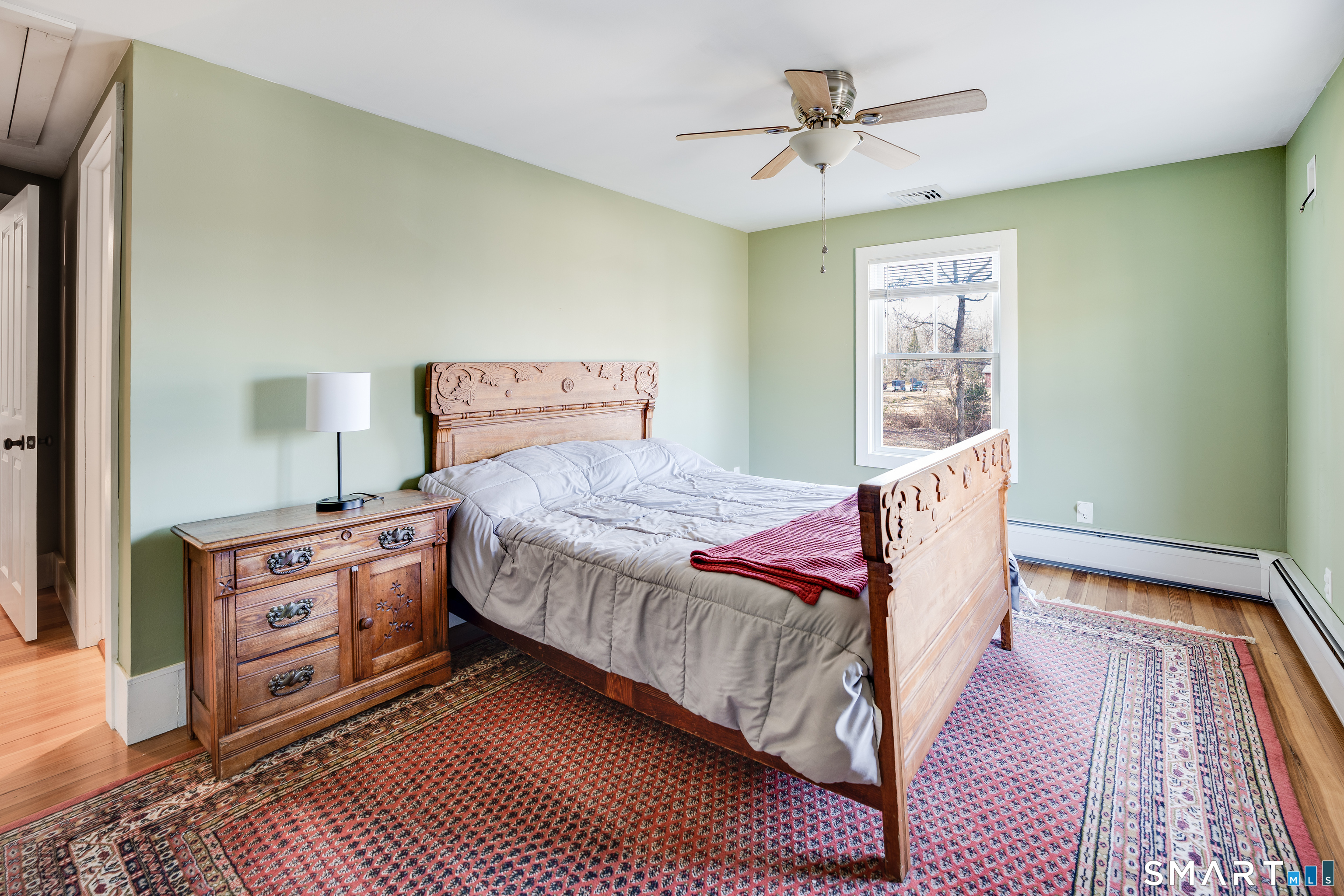 112 Schulman Veslak Road East Haddam, CT 06423 - Photo 14 of 26 a bedroom with a bed and a chandelier