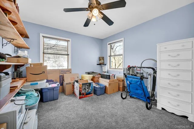 a bed room with furniture and a window