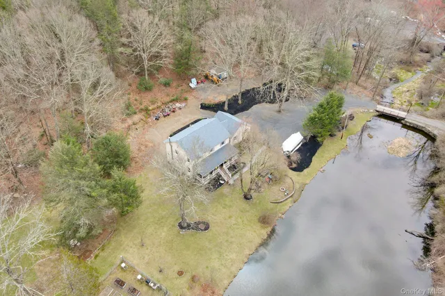 an aerial view of a house with outdoor space