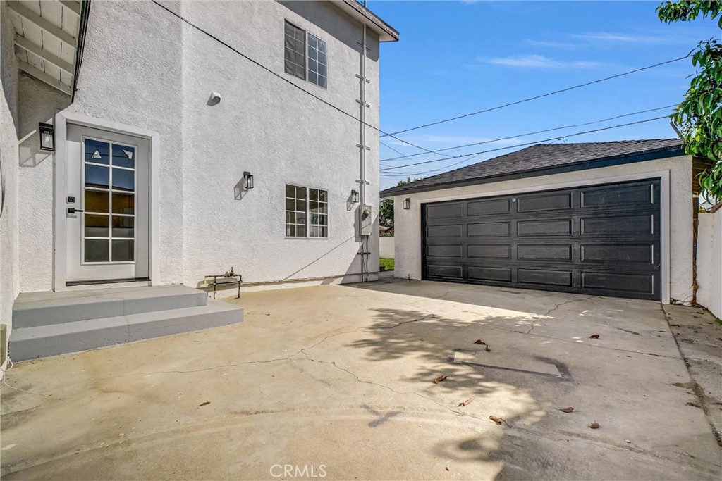 1200 South Castlegate Avenue Compton, CA 90221 - Photo 38 of 39 a front view of a house with a yard and garage