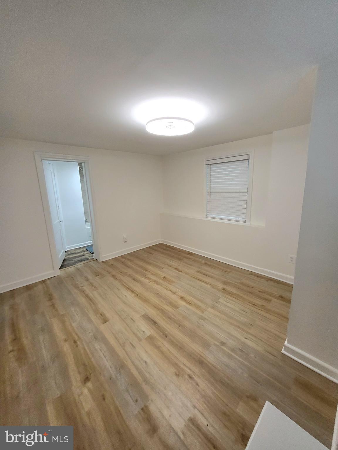 824 Philadelphia Avenue Silver Spring, MD 20910 - Photo 17 of 23 1st Floor Bedroom w/Luxury Vinyl Flooring
