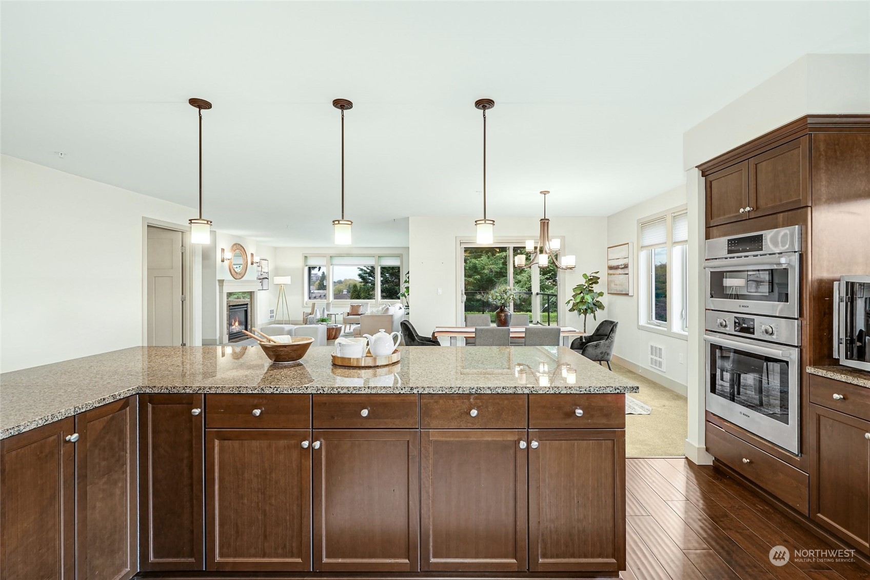 316 Walnut Street, Unit 201 Edmonds, WA 98020 - Photo 16 of 29 a kitchen with stainless steel appliances kitchen island granite countertop a sink a counter space and cabinets