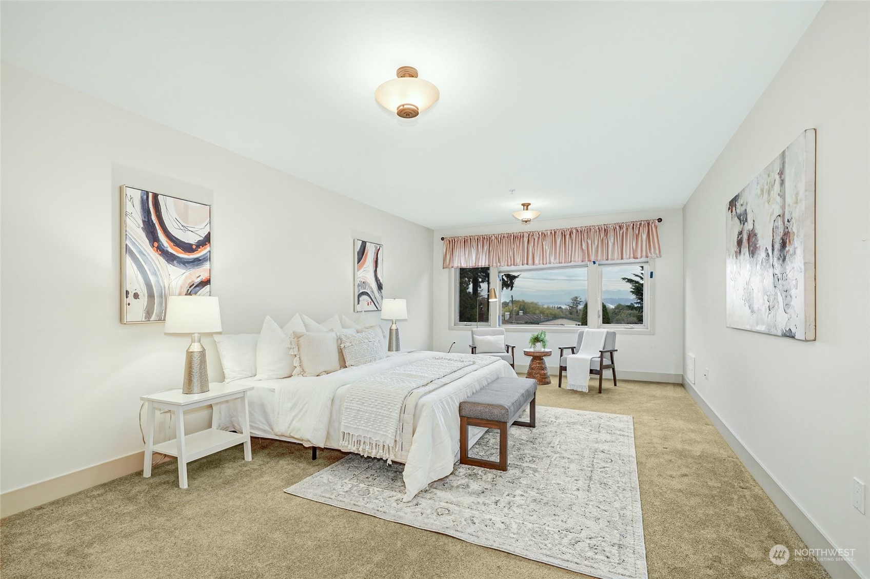 316 Walnut Street, Unit 201 Edmonds, WA 98020 - Photo 17 of 29 a bedroom with a bed and a chandelier