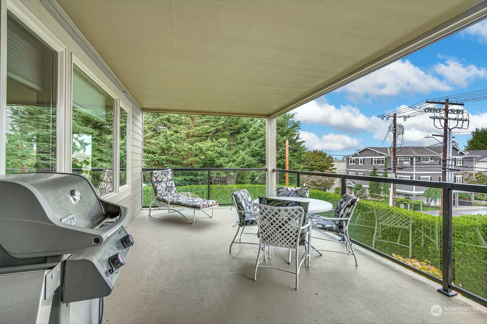316 Walnut Street, Unit 201 Edmonds, WA 98020 - Photo 24 of 29 a living room with furniture and floor to ceiling windows