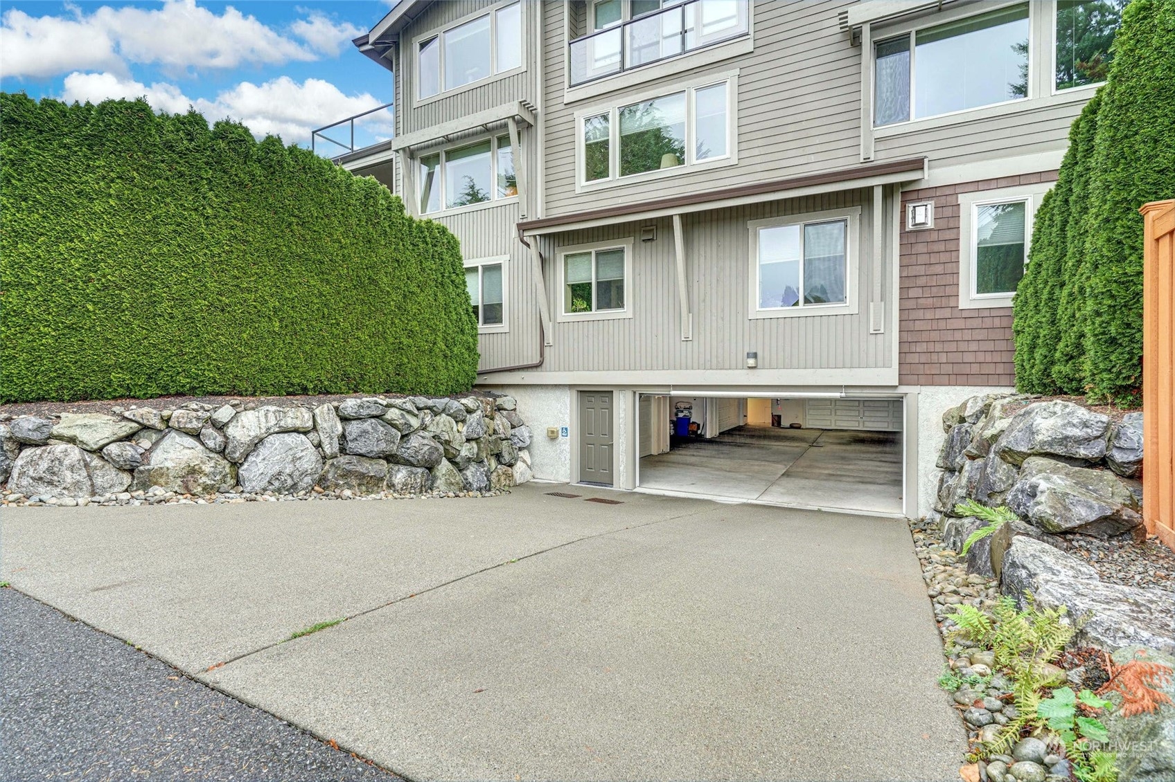 316 Walnut Street, Unit 201 Edmonds, WA 98020 - Photo 26 of 29 a front view of a house with a garden