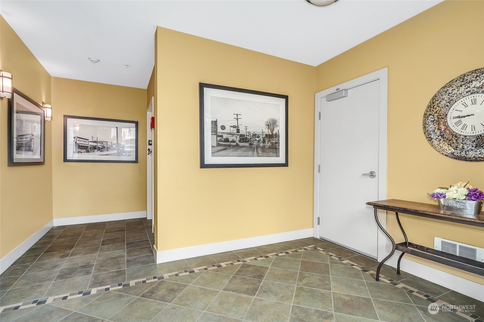 316 Walnut Street, Unit 201 Edmonds, WA 98020 - Photo 4 of 29 a view of room with furniture and paintings on the wall