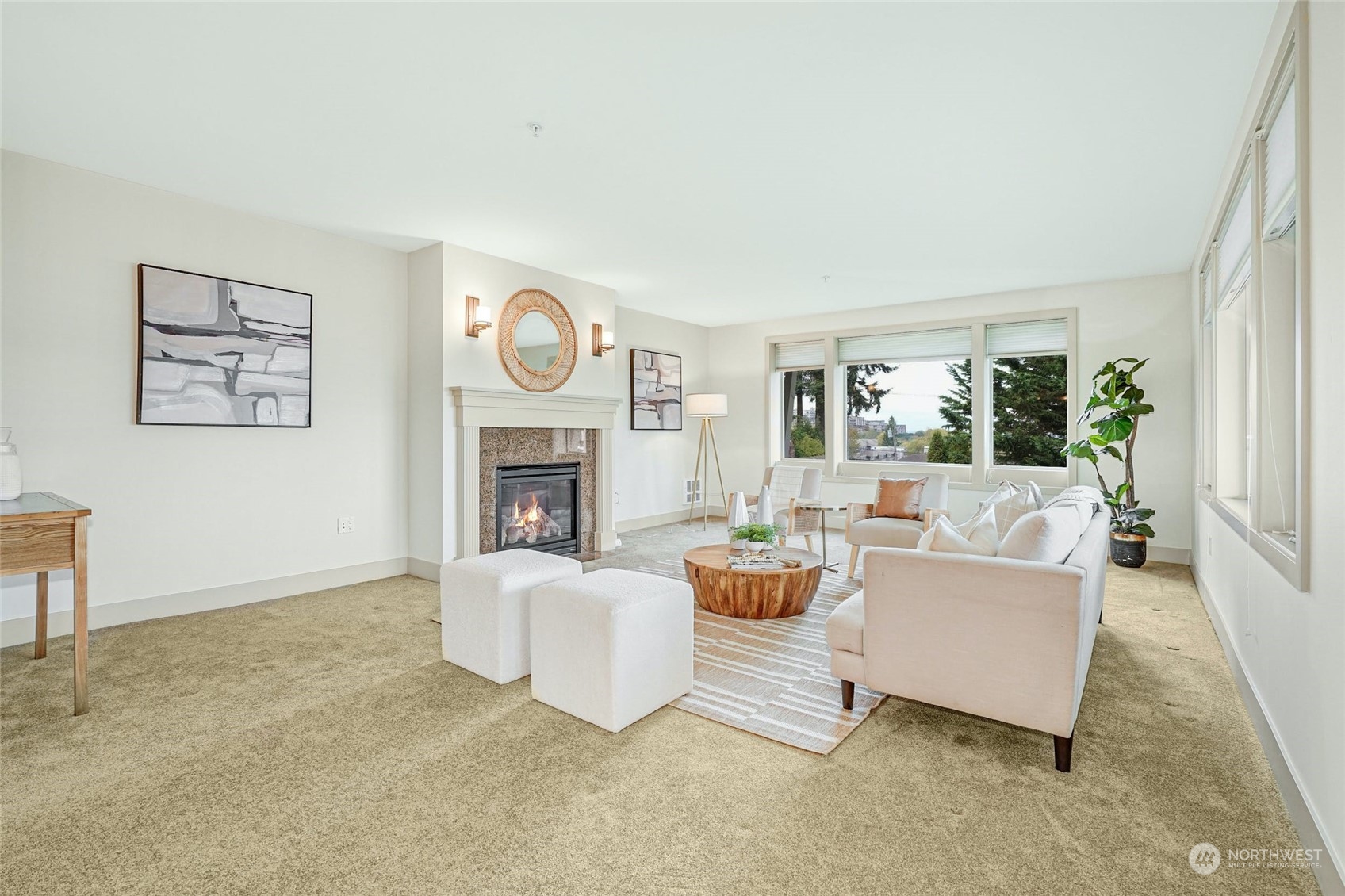 316 Walnut Street, Unit 201 Edmonds, WA 98020 - Photo 5 of 29 a living room with furniture a fireplace and a large window