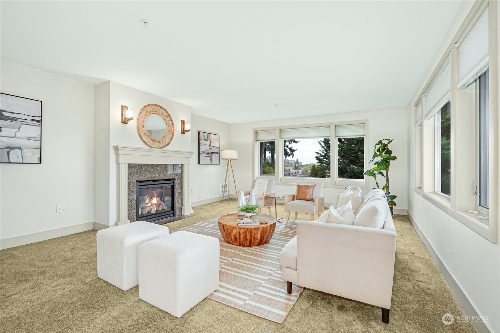 316 Walnut Street, Unit 201 Edmonds, WA 98020 - Photo 6 of 29 a living room with furniture a fireplace and a large window