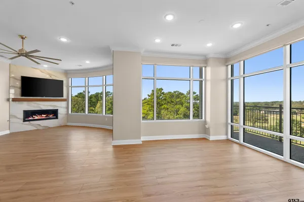 a view of a livingroom with furniture window and wooden floor
