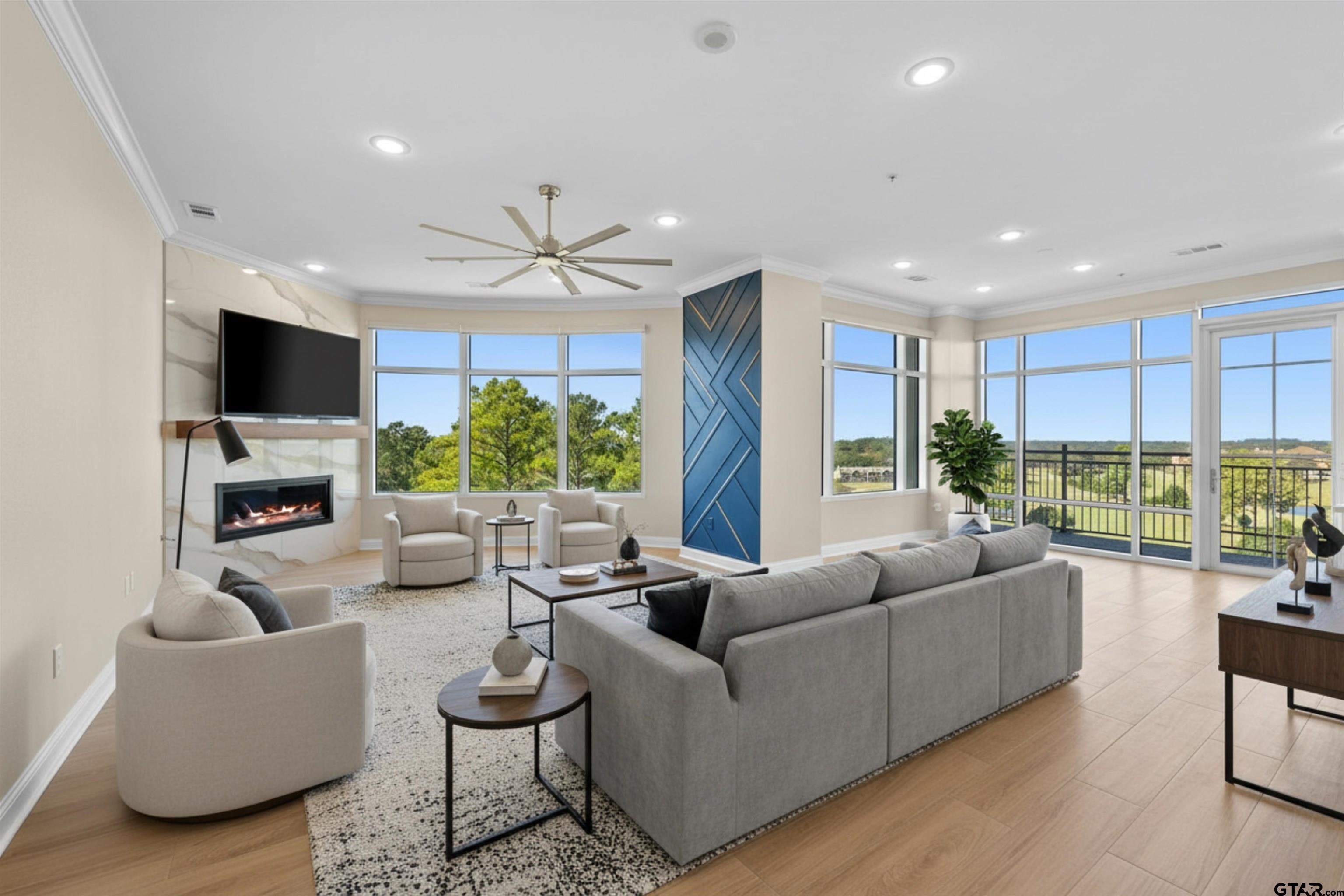 2801 Wexford Drive Tyler, TX 75709 - Photo 15 of 31 a living room with furniture fireplace and a large window