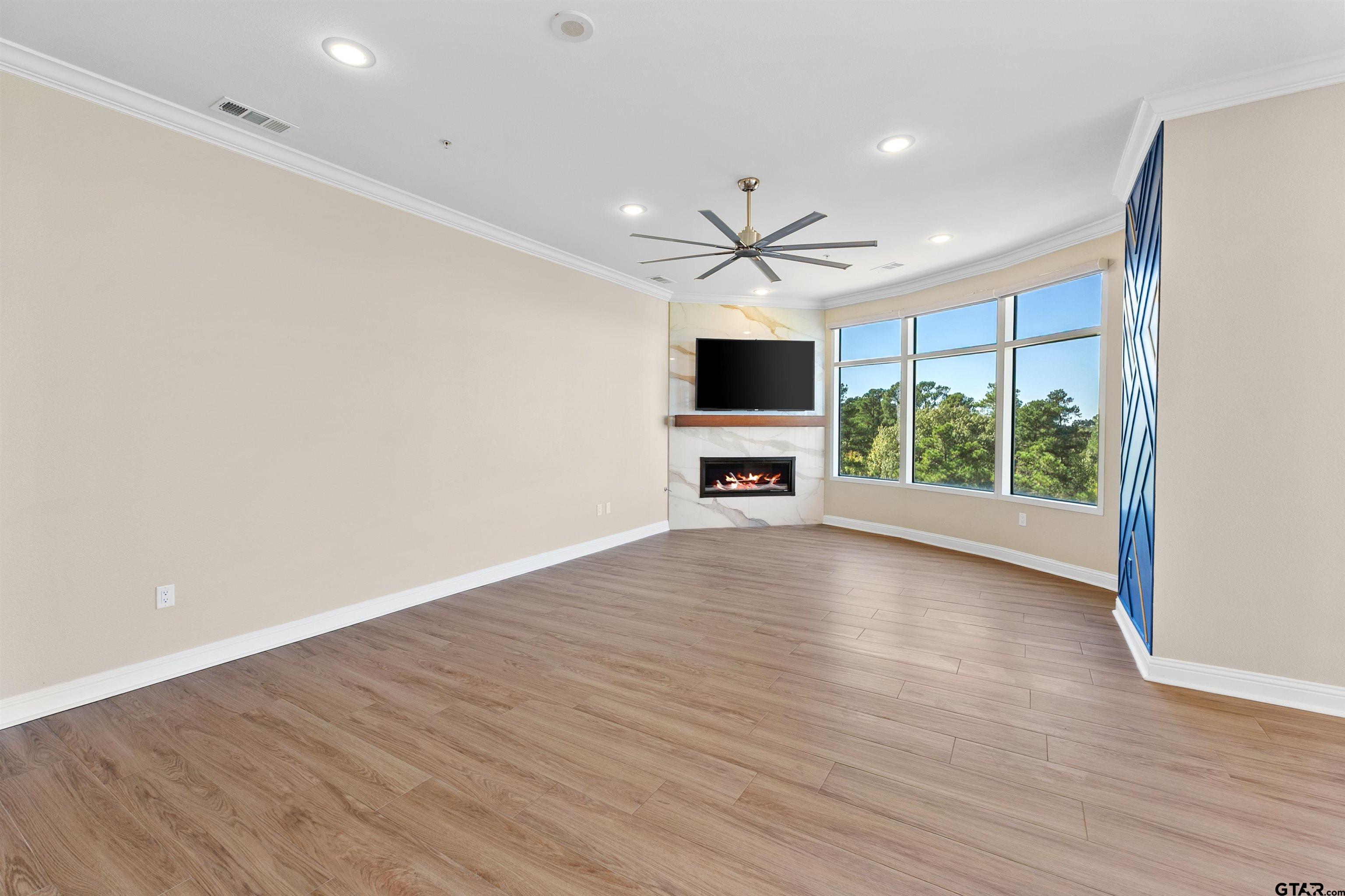 2801 Wexford Drive Tyler, TX 75709 - Photo 16 of 31 a view of livingroom with hardwood floor and a ceiling fan